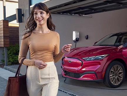 Man charging Ford Mustang Mach-E at home