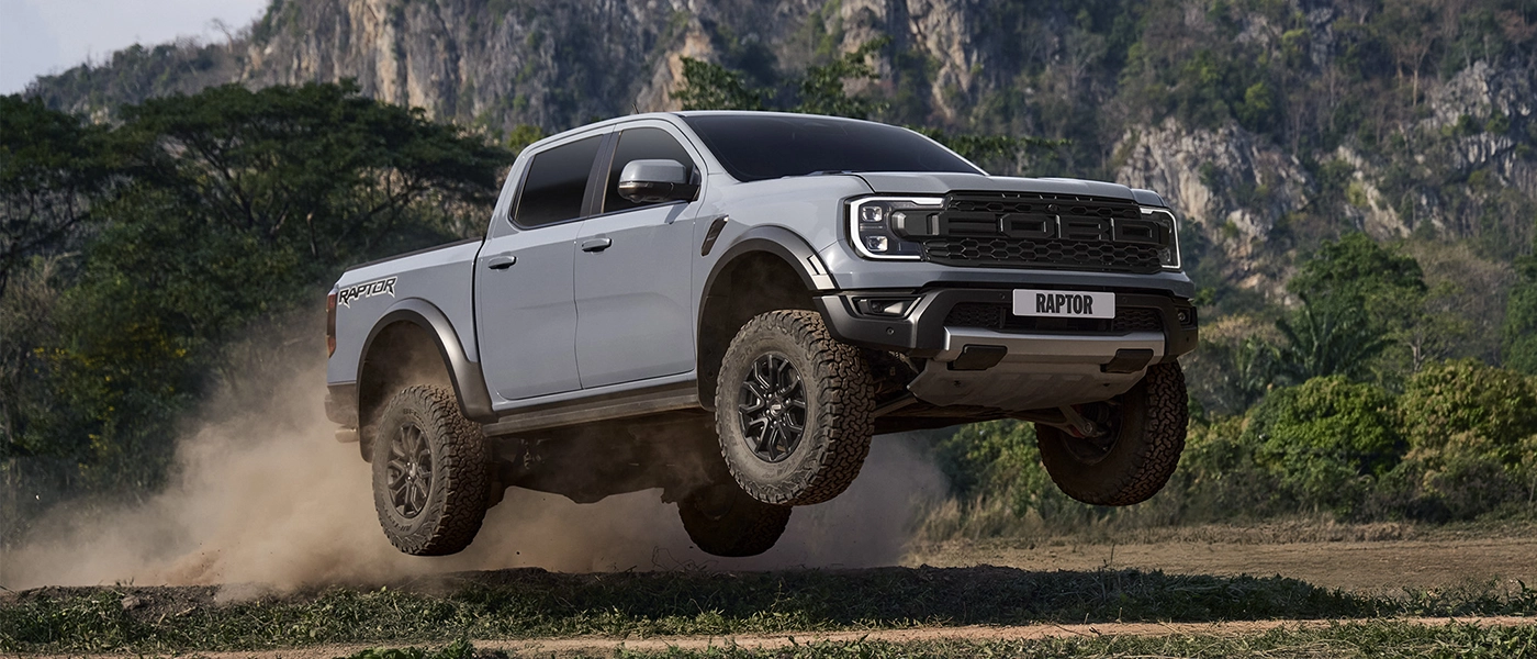 car in muddy on model new raptor