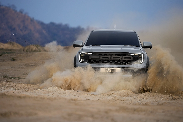 car in muddy on model new raptor